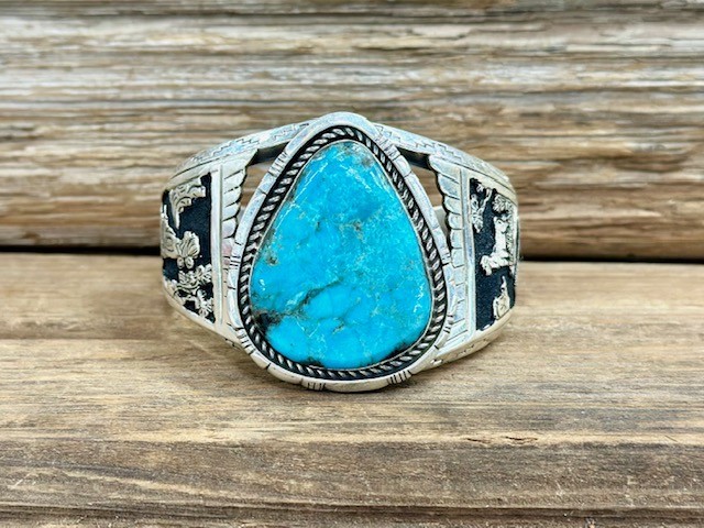 PB187- Pawn Navajo Storyteller with Turquoise Bracelet 